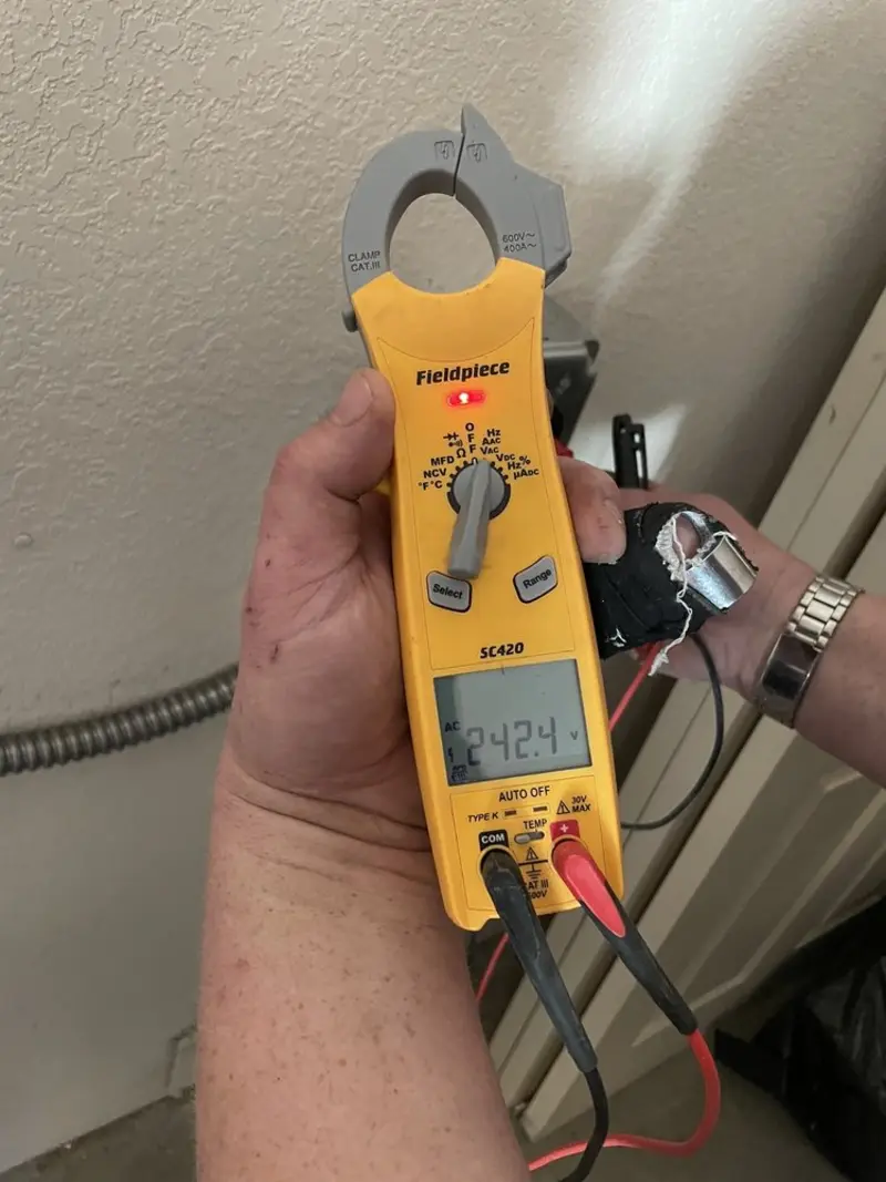 Voltage testing with clamp meter during Whole House Surge Protector in Starkville